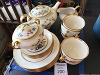 overall view of Paragon china pieces including teapot, creamer, cups and stack of plates