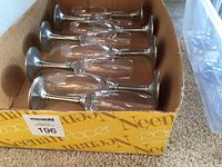 Eight pewter-stem champagne flutes in box