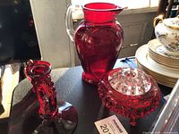 Closer angle showing pitcher and candlestick details