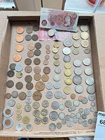 Tray of coins and £10 note overview