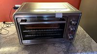 Front view of stainless steel Hamilton Beach toaster oven showing overall condition