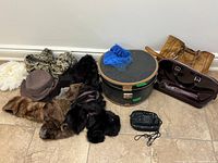 Group shot of all hats, stoles, handbags, hat box