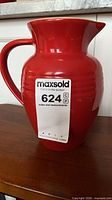 front view of red Le Creuset pitcher