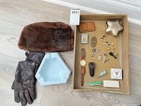 Entire lot laid out showing hat, gloves, ashtray, tray of small accessories