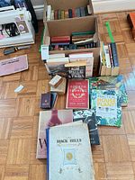 Overview of assorted books in and around box