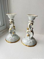 Front view of both Hackefors porcelain candlesticks