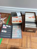 Album and two boxes with envelopes of stamps