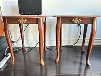 Front view of both wood night tables showing drawers, legs, finish