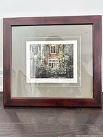 Front view of framed print showing artwork, mats and wood frame
