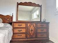 Front view showing dresser, mirror, drawer layout