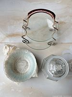 Top view of double-tier glass tray, stacked bowls, glass jar