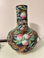 Full view of vase showing shape and relief decoration