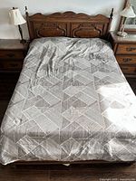 Full view of assembled queen bed frame with headboard and footboard