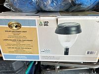 Retail box showing Hampton Bay Solar LED Stake Light, 6-pack label and product image
