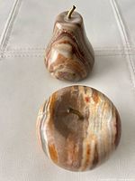 Banded onyx apple and pear showing size and stems