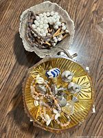 Overview of both bowls, hardware pieces and necklaces