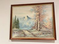 full view of framed mountain landscape oil painting