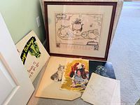 Group view: framed Bermuda map print and loose drawings