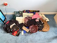 Overall group of handbags and totes on floor