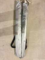 Two Coolibar umbrellas in branded carry sleeves