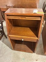 cabinet with cover open showing upper compartment and drawer