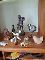 Group shot of all eight figurines on shelf