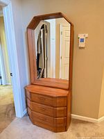 Front view of teak dresser with attached mirror