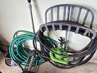 Overall view of both hoses, metal stand and two sprinklers