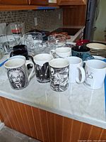 Overall view of mugs and glasses on countertop