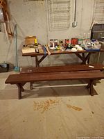 Picnic table with benches and miscellaneous items on top