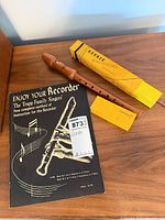 Recorder, box, and manual displayed on table