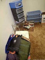 Overall lot with plastic drawer tower, blue shoe racks, metal rack, fabric bin and assorted bags