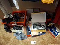 Overview of assorted shoes in boxes and on floor