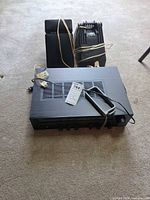 Yamaha R-300 receiver with both Polk speakers bundled behind