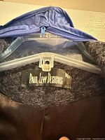 Paul Levy Designs brand label inside coat collar