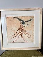 Front view of framed numbered print showing artwork, mat and frame