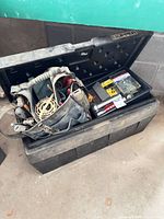 overall view of plastic chest with contents visible