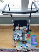 Overview showing walker and assorted medical items on floor