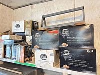 Shelf with multiple Bradley Flavor Bisquettes boxes of varying sizes and flavors