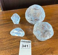 Group shot showing two Snowball votives and two Mats Jonasson crystal sculptures