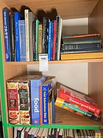 Overall view of two shelves showing cookbooks and jazz/art books