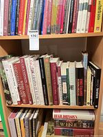 Shelf showing majority of hardcover wine books with lot tag