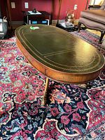 Full view of coffee table showing leather top, overall design