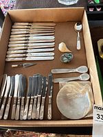 Overview of all flatware pieces, spoons, shells and plates