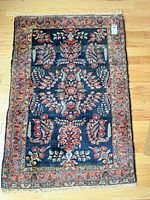 Full view of navy Persian wool rug