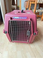 Front view showing metal gate, latch, Petmate branding