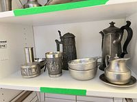 Shelf view showing all pewter and metal items