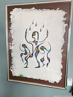 Framed Norval Morrisseau "Rain Dance" print showing entire artwork, mat and frame