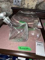 Orbital decanter with stopper, funnel, stand visible