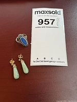 Group shot of ring and pair of jade earrings